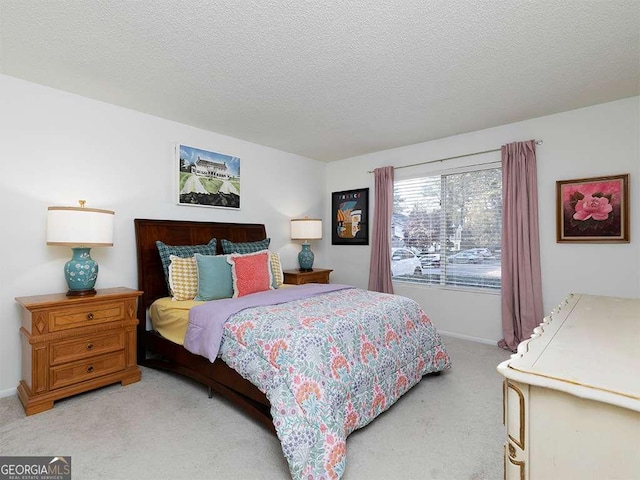 carpeted bedroom with a textured ceiling