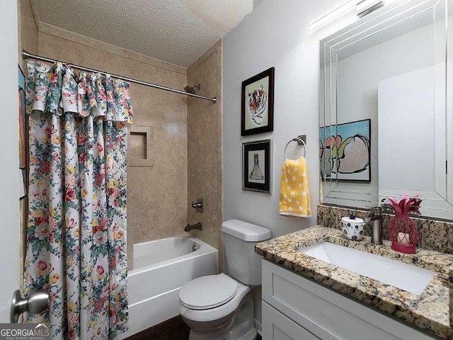 full bathroom with vanity, shower / bath combination with curtain, a textured ceiling, and toilet