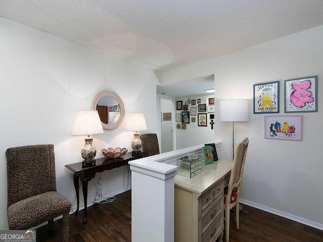 office space with a textured ceiling and dark wood-type flooring