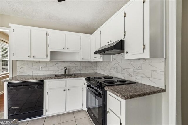 kitchen featuring a textured ceiling, sink, black appliances, white cabinetry, and light tile patterned flooring