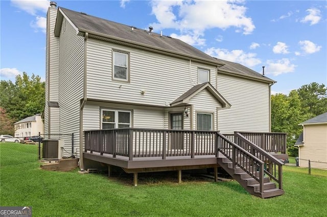 back of property featuring a lawn, cooling unit, and a wooden deck