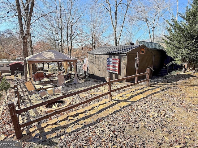 exterior space with a gazebo and an outbuilding