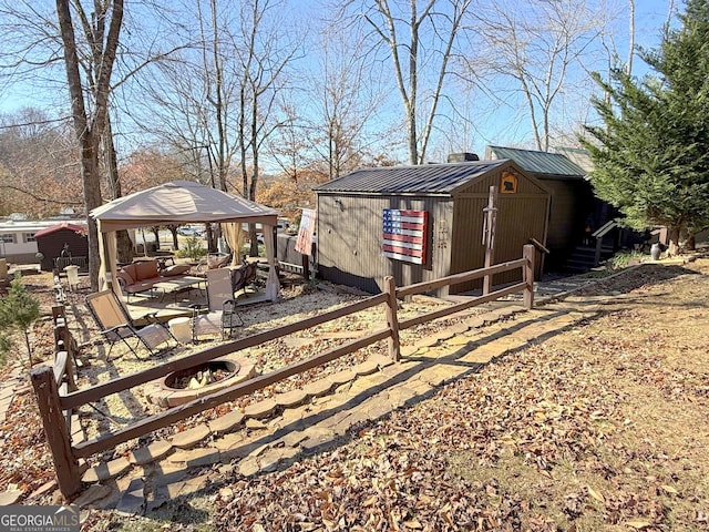 exterior space with a gazebo and an outbuilding