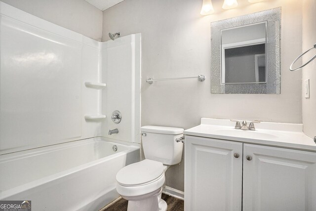 full bathroom with shower / tub combination, vanity, toilet, and hardwood / wood-style floors