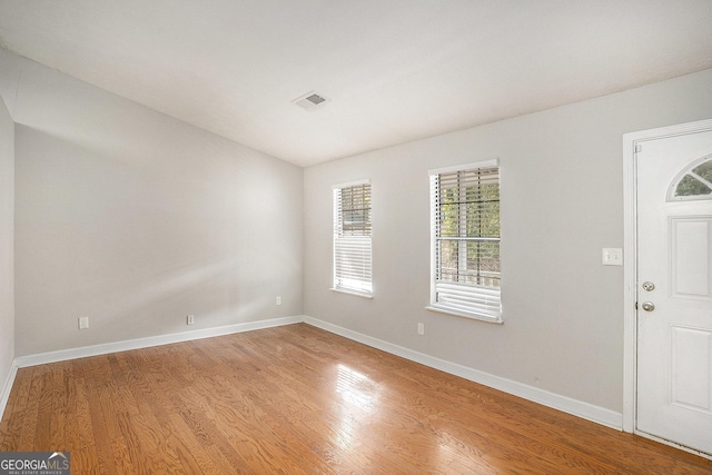 foyer entrance with hardwood / wood-style flooring