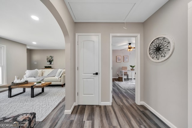 corridor with dark wood-type flooring