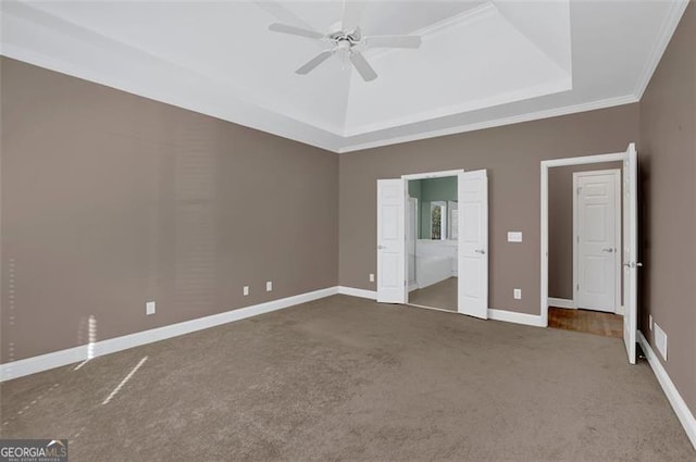 unfurnished bedroom featuring carpet flooring, connected bathroom, ceiling fan, and crown molding