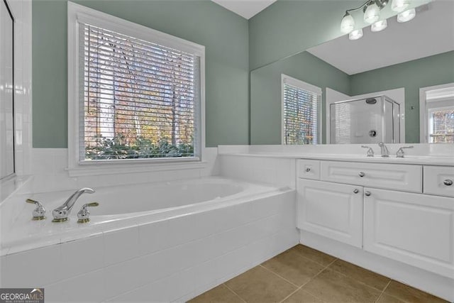 bathroom featuring tile patterned flooring, vanity, and independent shower and bath