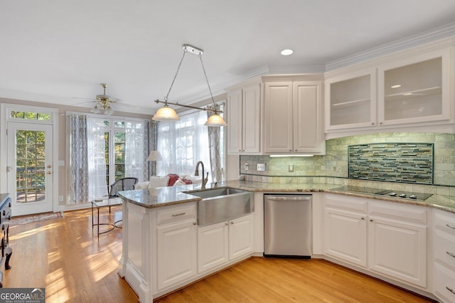 kitchen featuring stainless steel dishwasher, ceiling fan, pendant lighting, light hardwood / wood-style flooring, and white cabinets