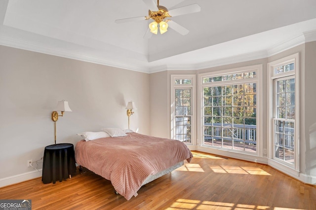 bedroom featuring access to outside, ceiling fan, ornamental molding, and hardwood / wood-style flooring