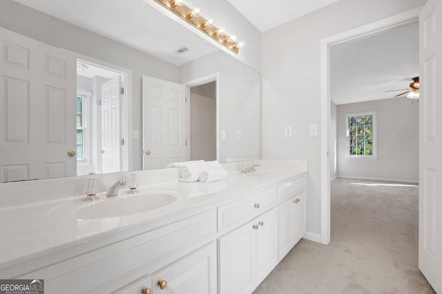 bathroom with ceiling fan and vanity