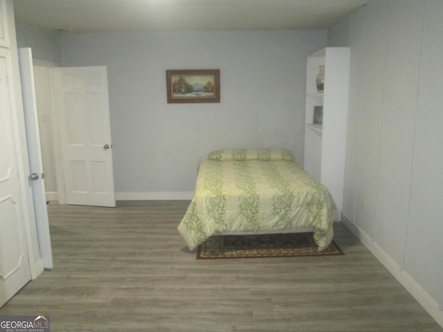 bedroom with hardwood / wood-style floors