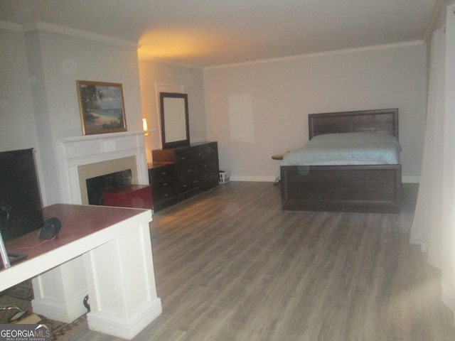 bedroom featuring ornamental molding and dark wood-type flooring