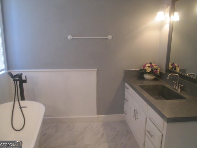 bathroom featuring vanity and a bathtub