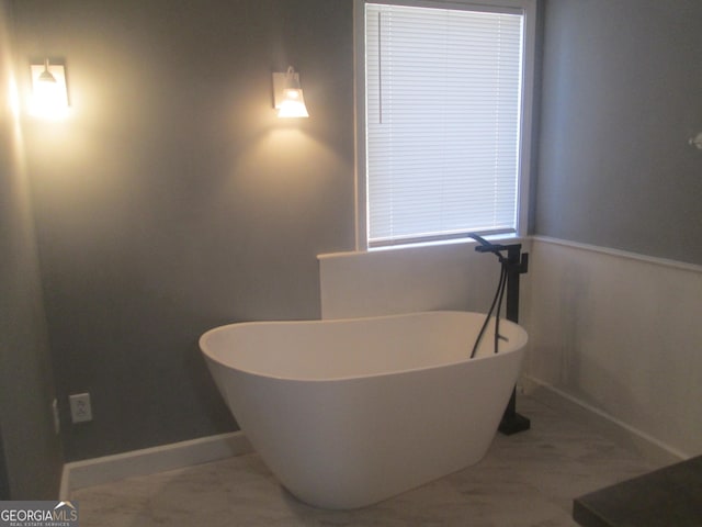 bathroom with a washtub