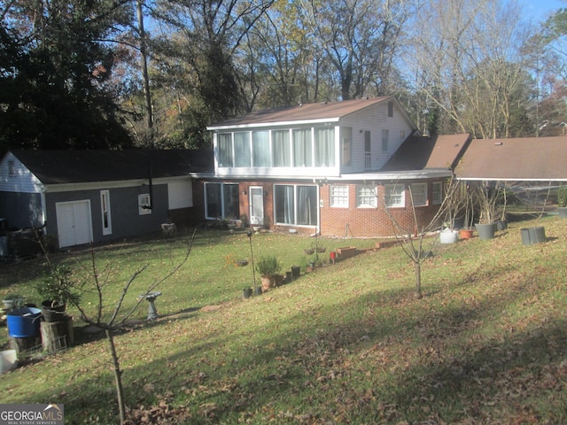 rear view of house with a lawn