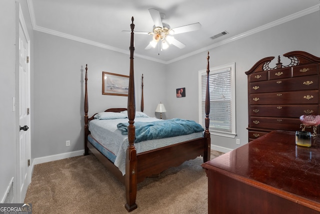 carpeted bedroom with ceiling fan and crown molding