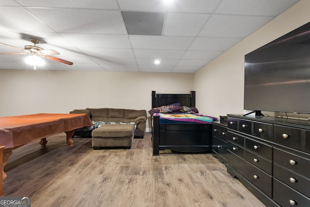 bedroom featuring a paneled ceiling, ceiling fan, light hardwood / wood-style floors, and billiards