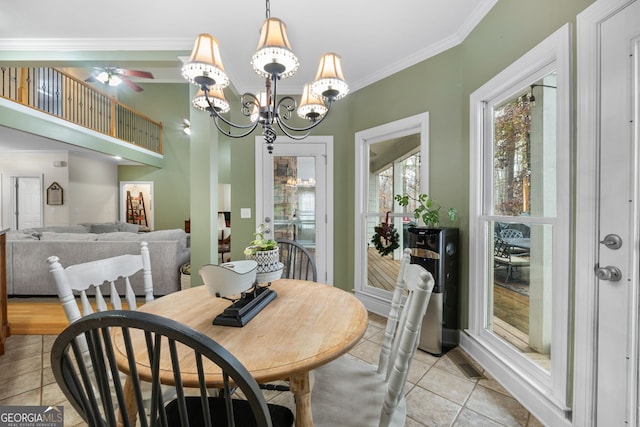 tiled dining area featuring ceiling fan with notable chandelier and ornamental molding