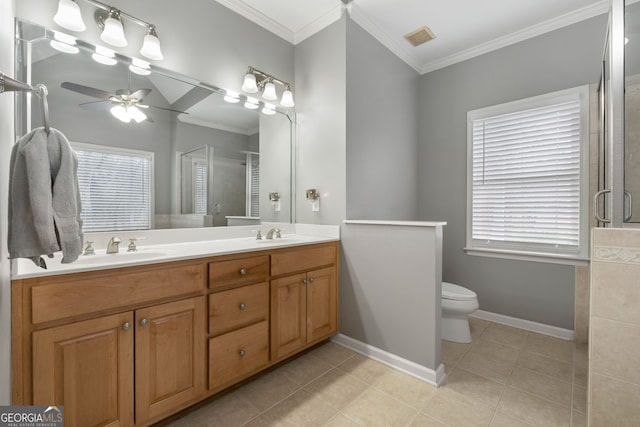 bathroom with vanity, a wealth of natural light, ornamental molding, and a shower with shower door