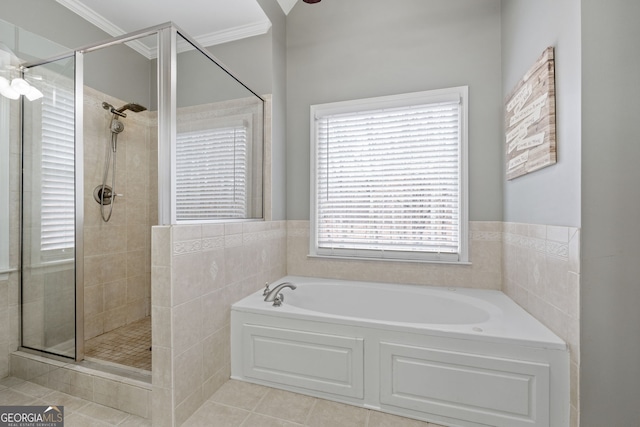 bathroom with tile patterned floors, crown molding, and independent shower and bath