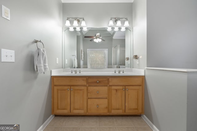 bathroom with ceiling fan, tile patterned flooring, vanity, and ornamental molding