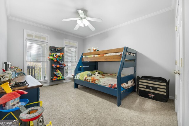 carpeted bedroom with ceiling fan and crown molding