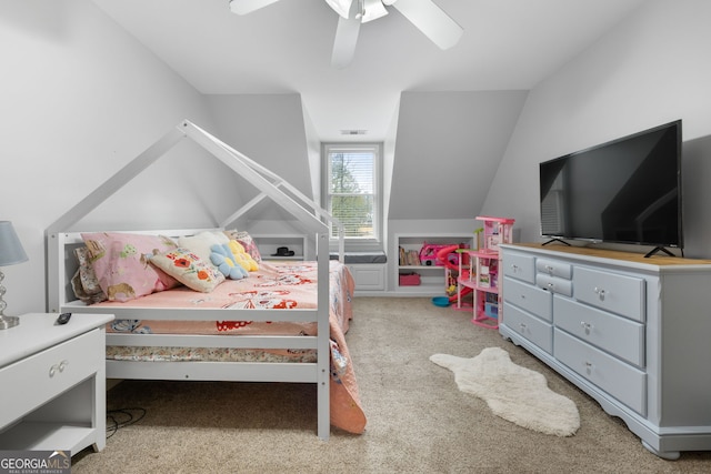 bedroom featuring ceiling fan, light carpet, and vaulted ceiling