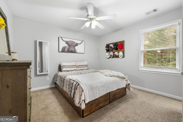 carpeted bedroom with ceiling fan