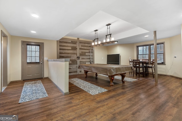 playroom with a wealth of natural light, dark hardwood / wood-style flooring, and billiards