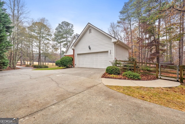 view of side of home featuring a garage