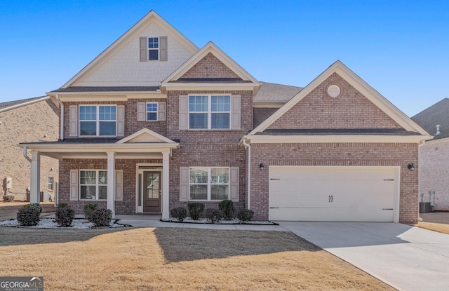 craftsman-style house with a porch, a garage, and central air condition unit