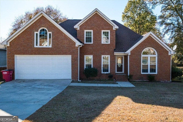 view of front property featuring a garage and a front lawn