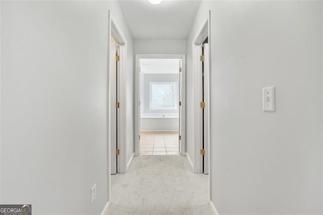 corridor with light colored carpet