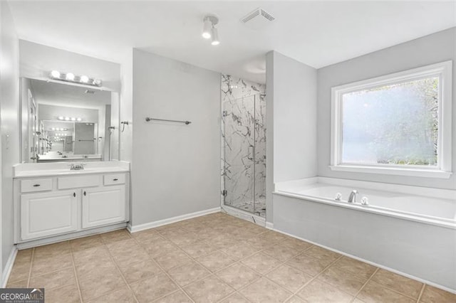 bathroom with plus walk in shower and vanity