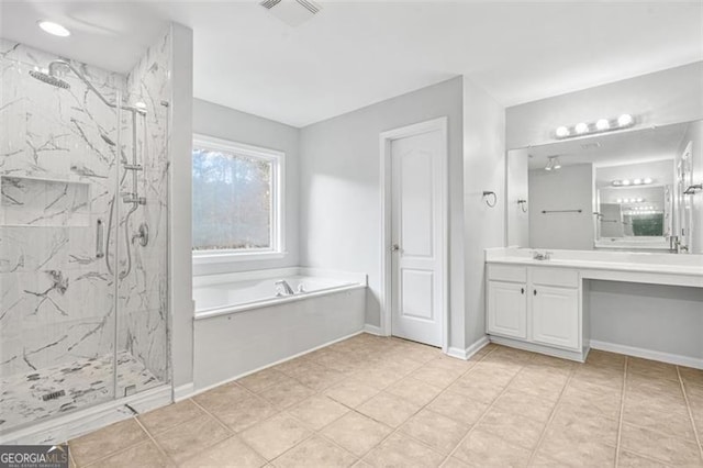 bathroom featuring tile patterned flooring, vanity, and independent shower and bath