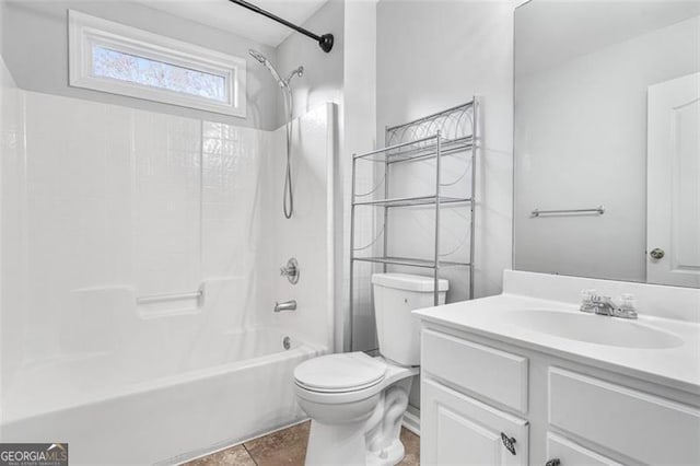 full bathroom featuring tile patterned flooring, vanity, toilet, and washtub / shower combination