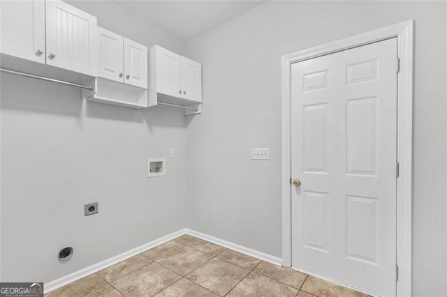 laundry room featuring hookup for an electric dryer, cabinets, light tile patterned floors, and hookup for a washing machine