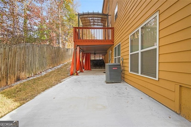 view of side of property with cooling unit