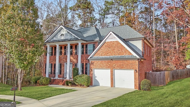 greek revival house featuring a garage and a front lawn