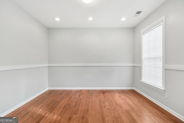 spare room featuring light wood-type flooring