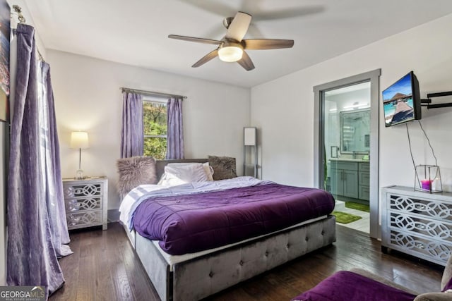 bedroom with ceiling fan, dark wood-type flooring, and ensuite bath