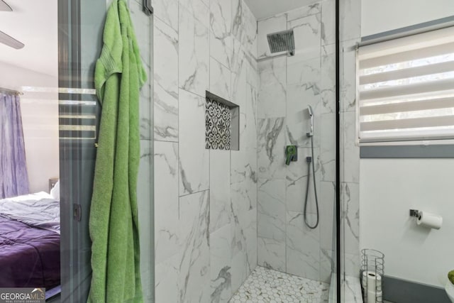 bathroom featuring tiled shower