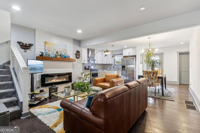 living room with sink and hardwood / wood-style flooring