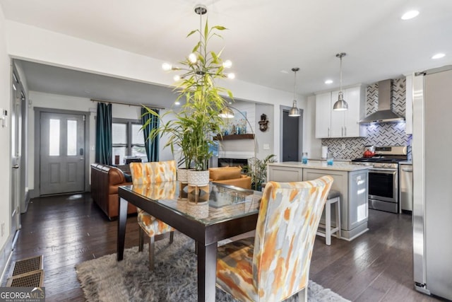 dining space featuring dark hardwood / wood-style floors