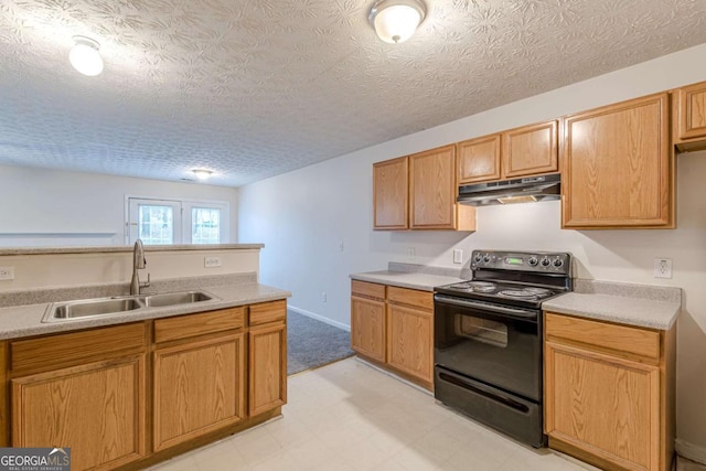 kitchen with black electric range, a textured ceiling, and sink