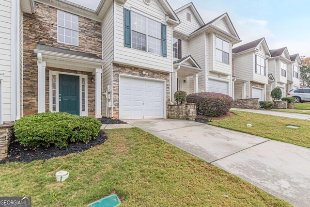 view of property with a front lawn and a garage