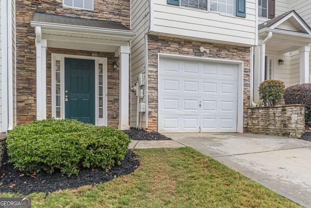 entrance to property featuring a garage