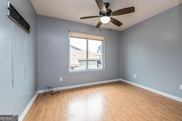 spare room featuring ceiling fan and light wood-type flooring