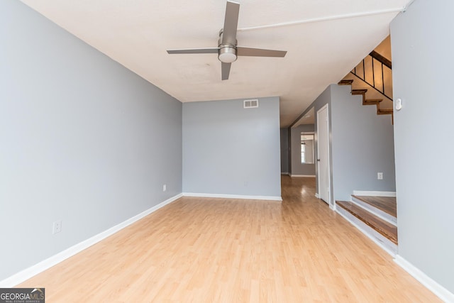 unfurnished room with ceiling fan and light hardwood / wood-style floors